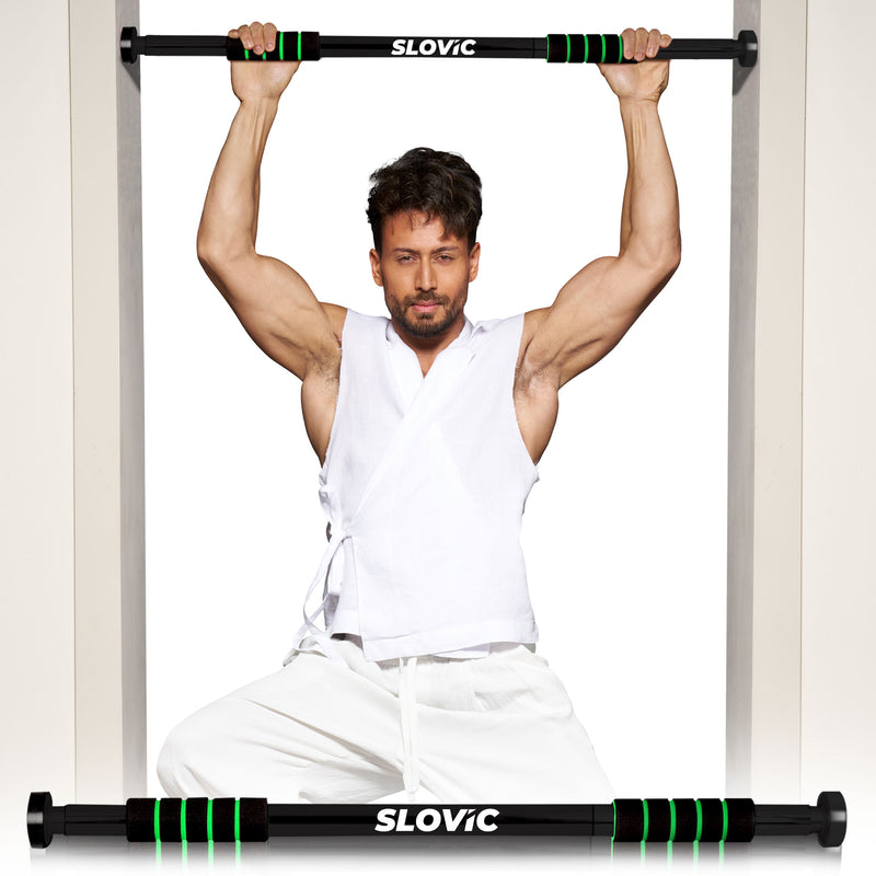 Tiger Shroff exercising using a SLOVIC pull-up bar indoors.