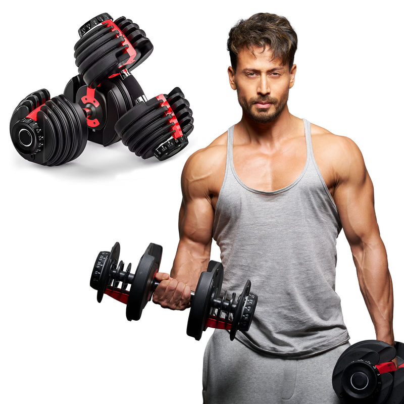 Tiger Shroff holding
slovic adjustable dumbbells with a white background