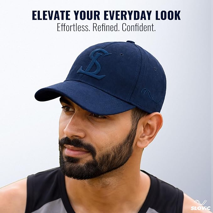 Man wearing a navy blue cap with a logo, against a light gray background.