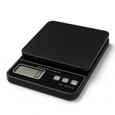 Black digital kitchen scale on a white background