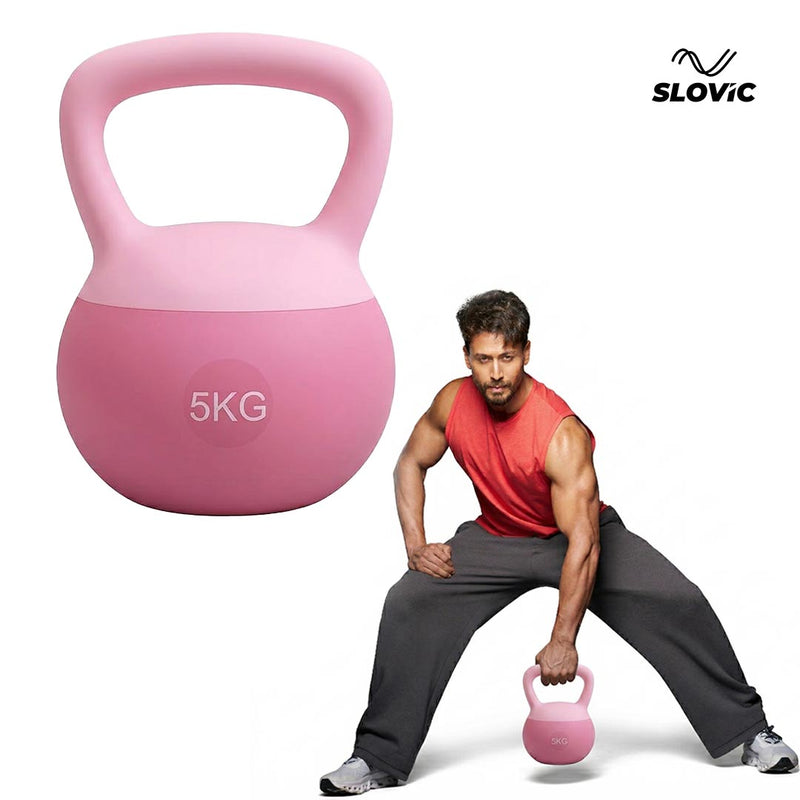 Tiger Shroff exercising with a pink kettlebell labeled '5KG' and the brand 'Slovic' visible.