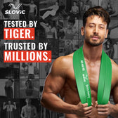 Tiger Shroff holding green resistance bands with Slovic branding and promotional text.