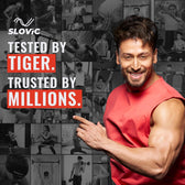 Tiger Shroff in red shirt posing with promotional text for Slovic, a brand trusted by millions. Gym Ghar Lao