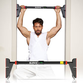 Tiger Shroff using a SLOVIC pull-up bar against a white background