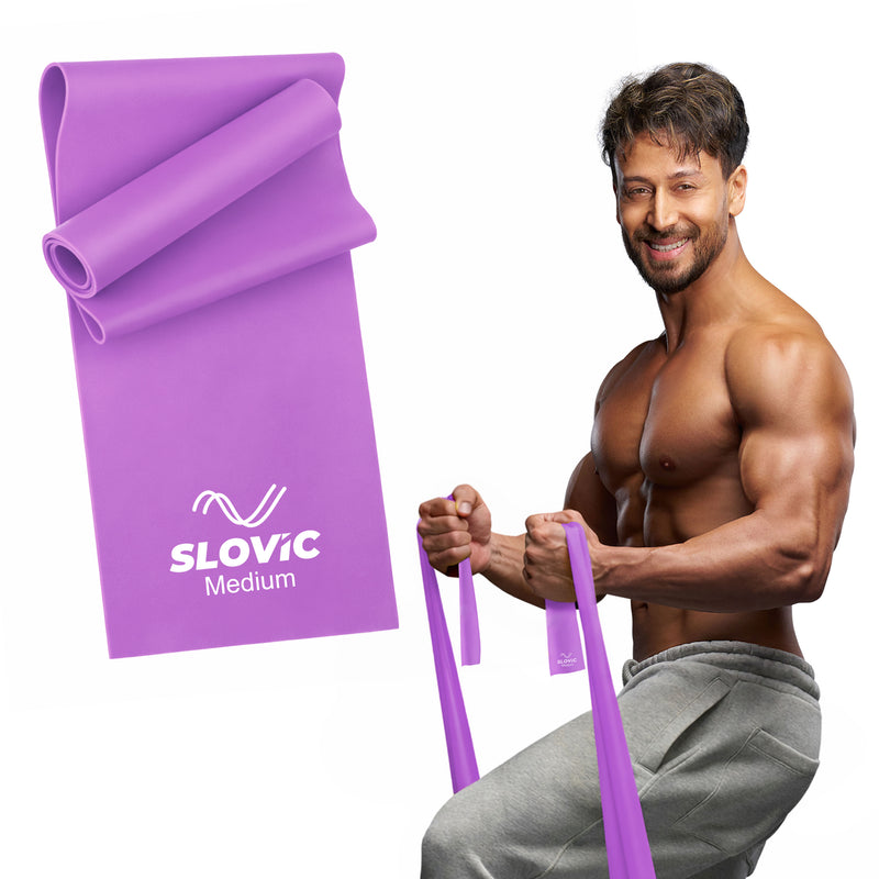 Tiger Shroff using a purple Sloivc thera resistance band with SLOVIC branding on a white background