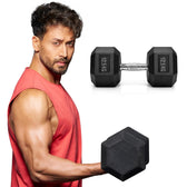 Tiger shroff holding a pair of 12.5 kg hexagonal dumbbells on a white background