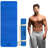 Blue yoga exercise mat with 'Slovic' branding, rolled up and standing, next to  Tiger shroff in gray pants.