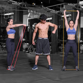 Two women and a man exercising with Slovic resistance bands in a gym setting.
